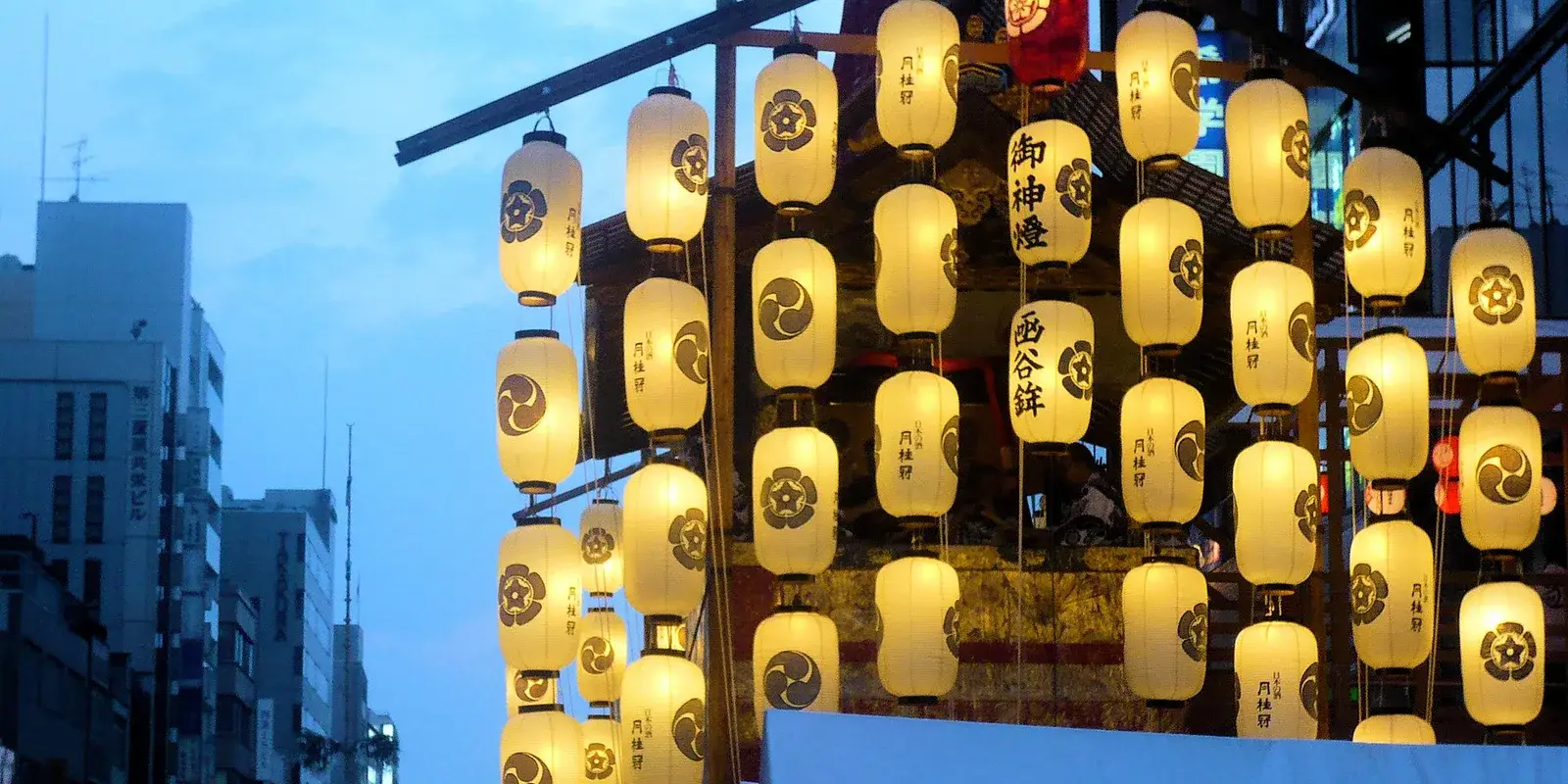 Glowing paper lanterns hung in tiers on a Gion Matsuri float during the yoiyama eve-night in Kyoto