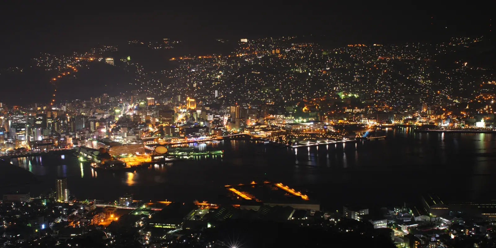Nagasaki's harbor city lit up at night, seen from the Mount Inasa observation deck