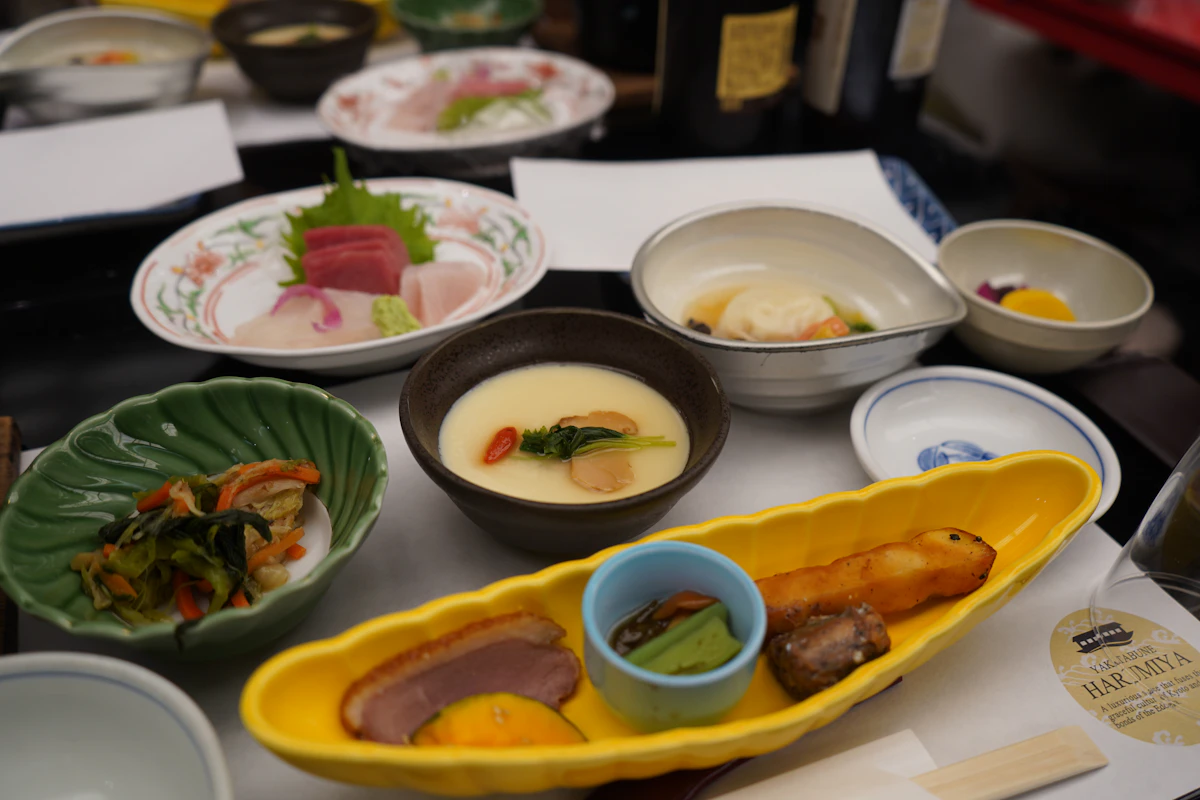A traditional kaiseki dinner with colorful small dishes arranged on a table