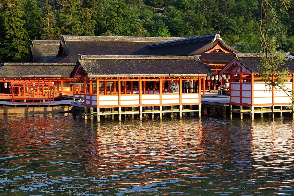 Seen across the water at high tide: the stilted halls and corridors of Itsukushima Shrine standing on the sea