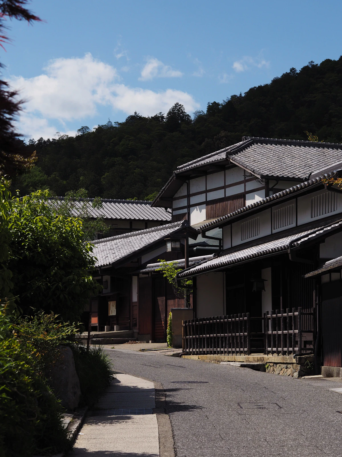 Traditional Japanese houses lining a quiet, spotlessly clean street in Kyoto