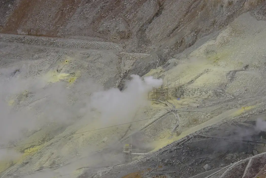Sulphur-yellow ground and steam vents in the Owakudani valley, seen from above