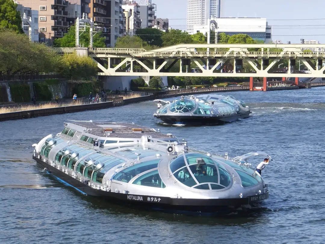The Tokyo Cruise water buses Hotaluna and Himiko passing on the Sumida River
